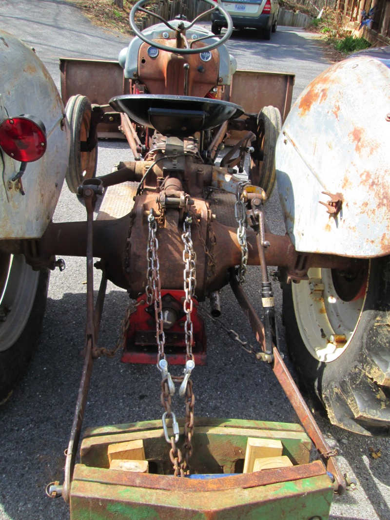 Additional chains to hold the rear weight off the ground, when the front blade is in the lowered position